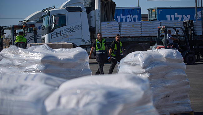 Humanitarian group pauses aid trucks bound for Gaza, citing Israeli restrictions